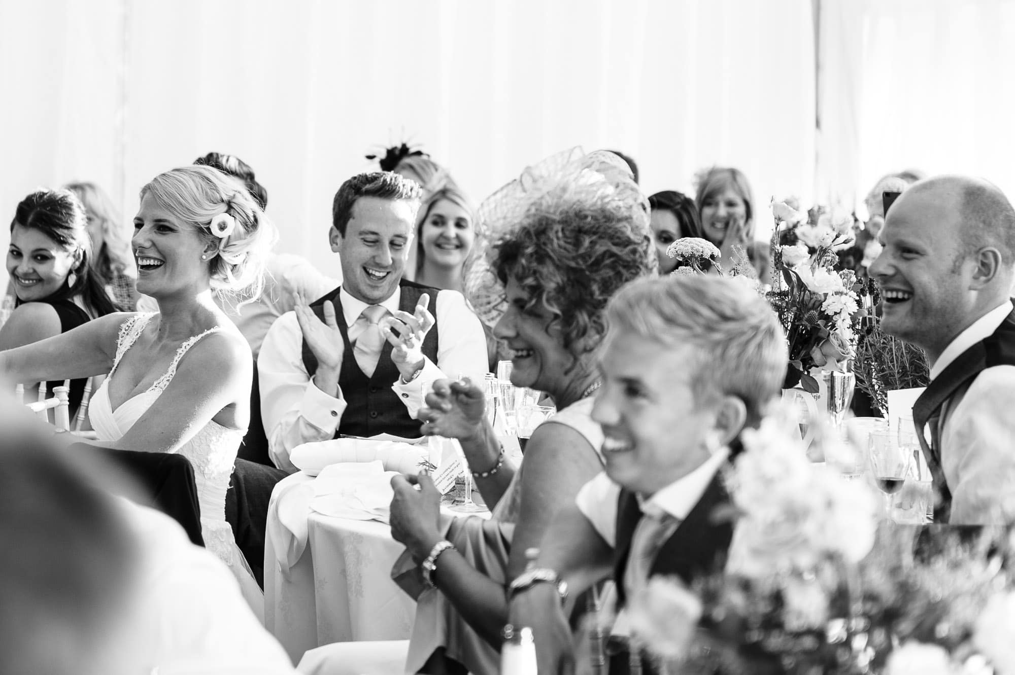 Groom laughing during the speeches at Hockering House