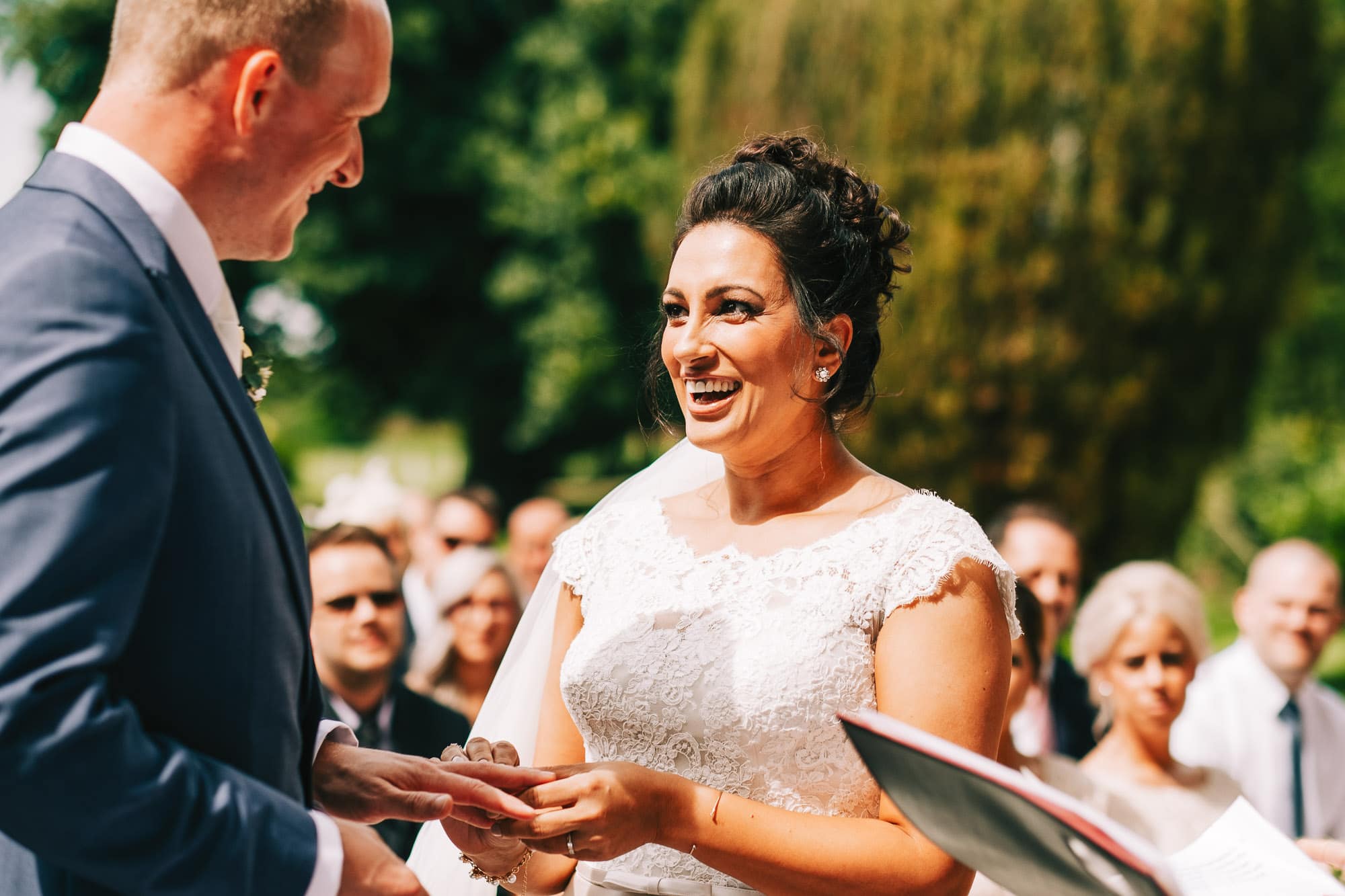 Bride and groom exchanging rings