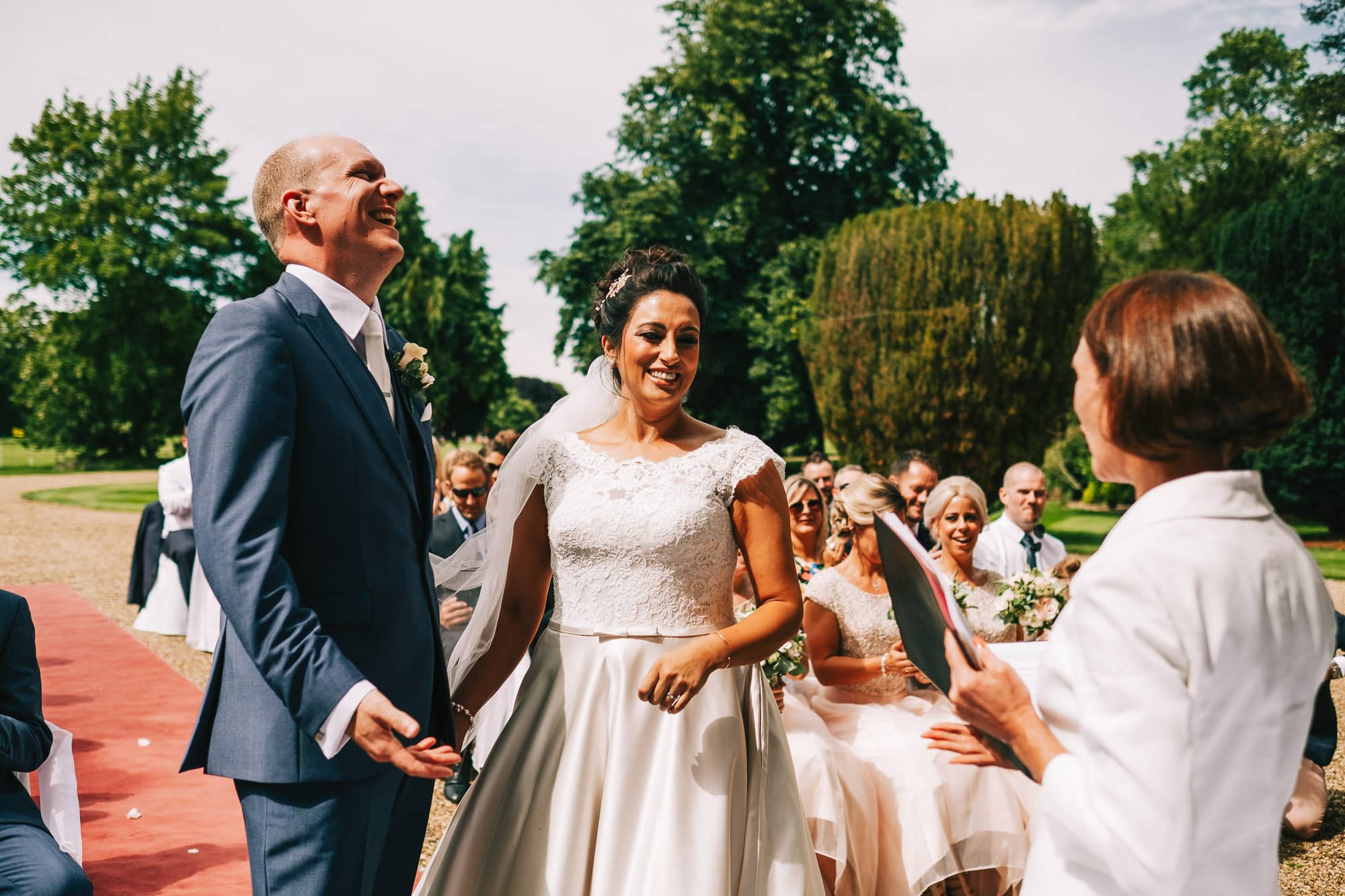 Bride and groom laughing during the ceremony