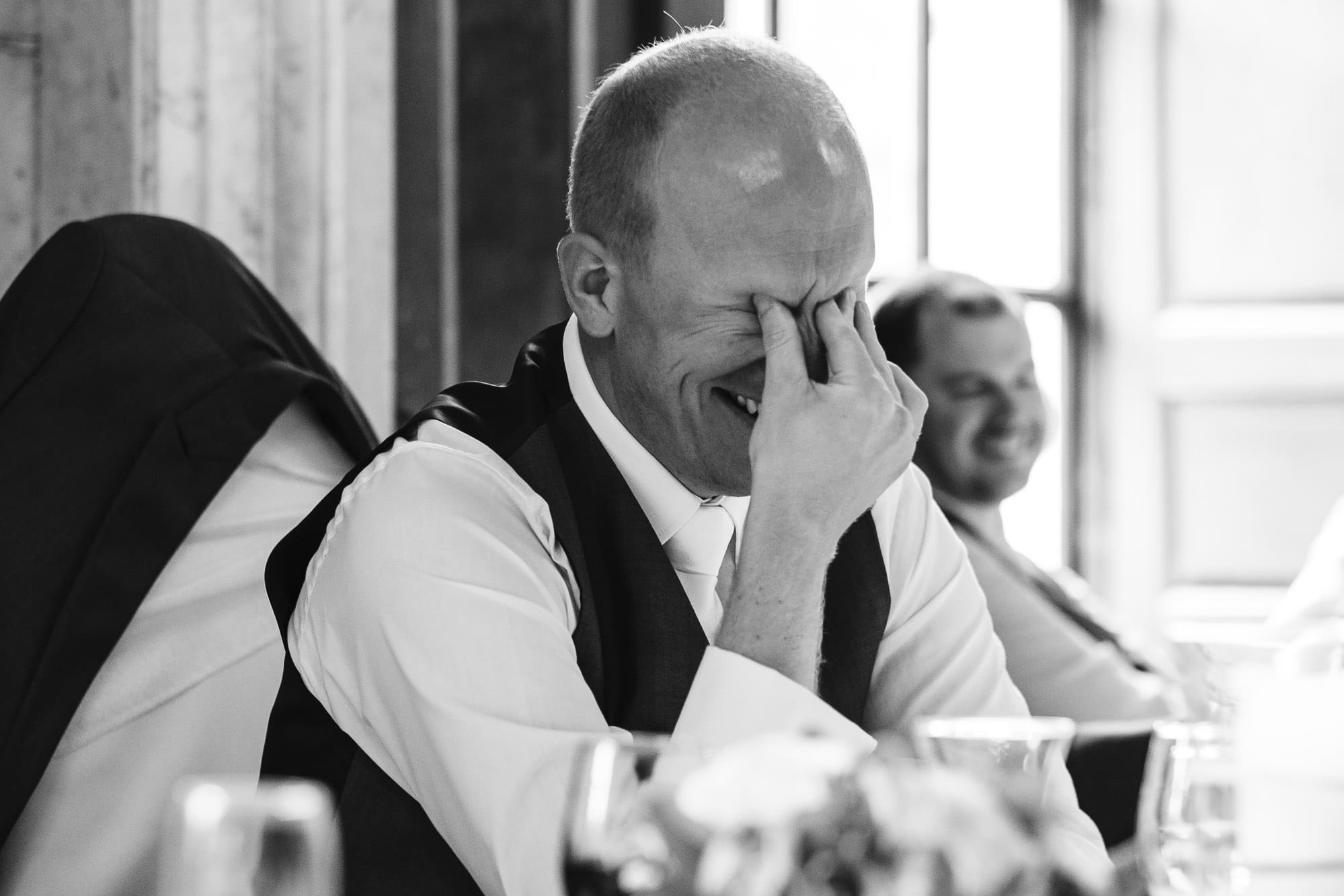 Groom embarrassed during the speeches