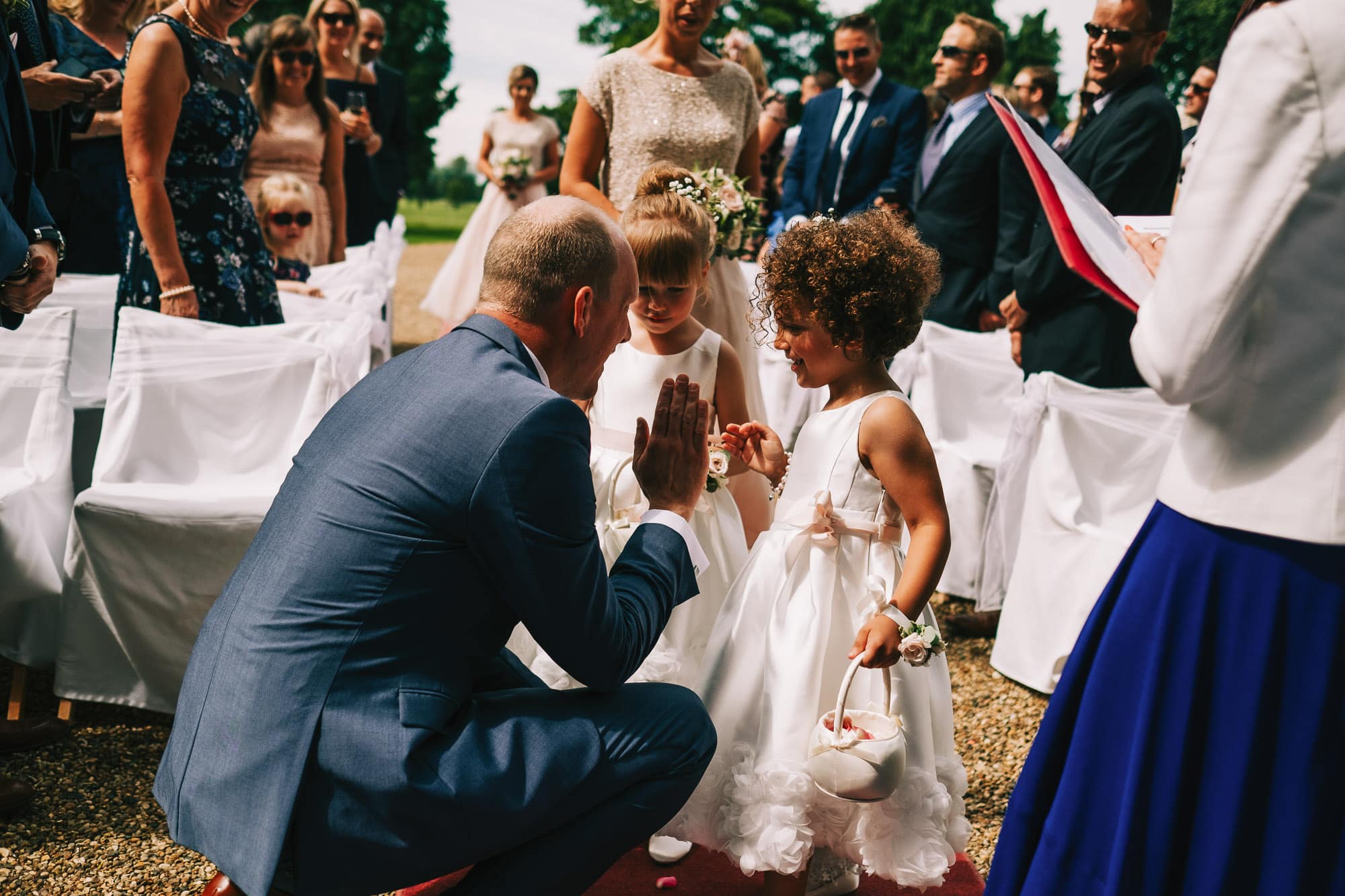 Grooms high fives his daughter