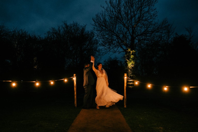 Rosie and Luke dancing outside in the darkness