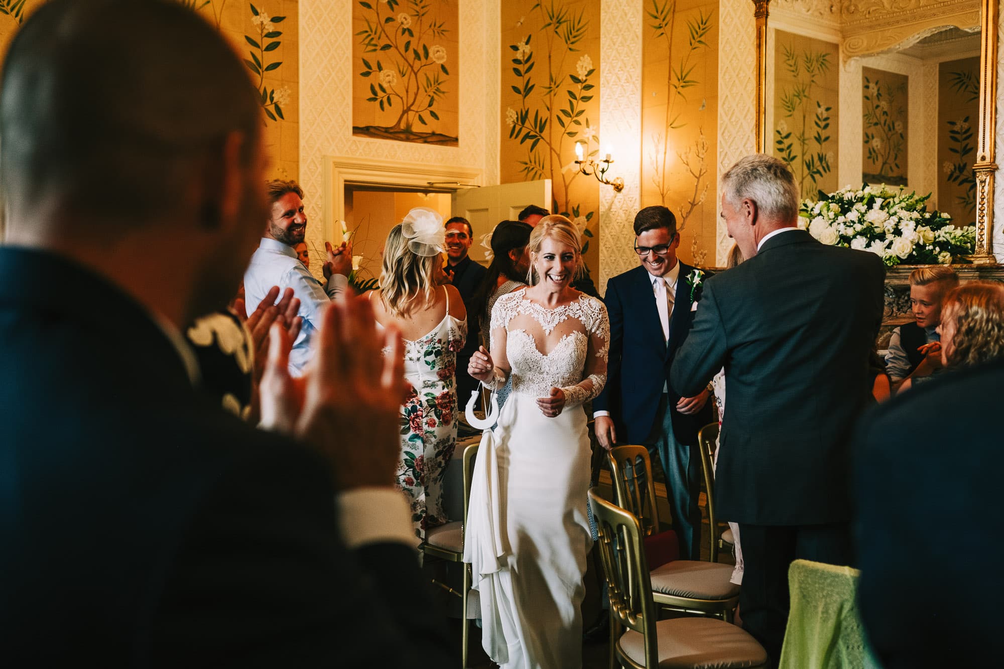 Bride and groom enter the dining room at Hampden House