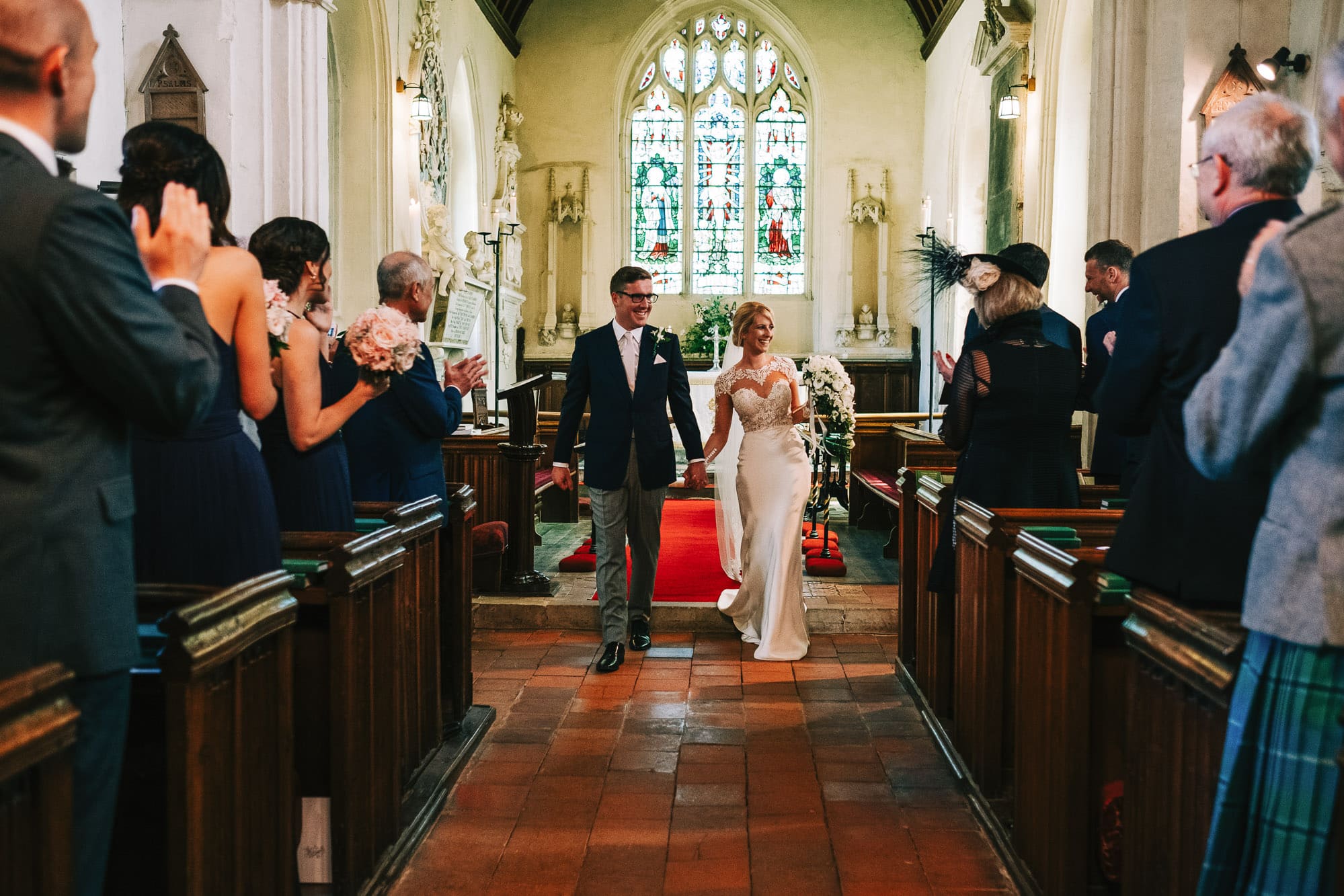 Bride and groom leave the church