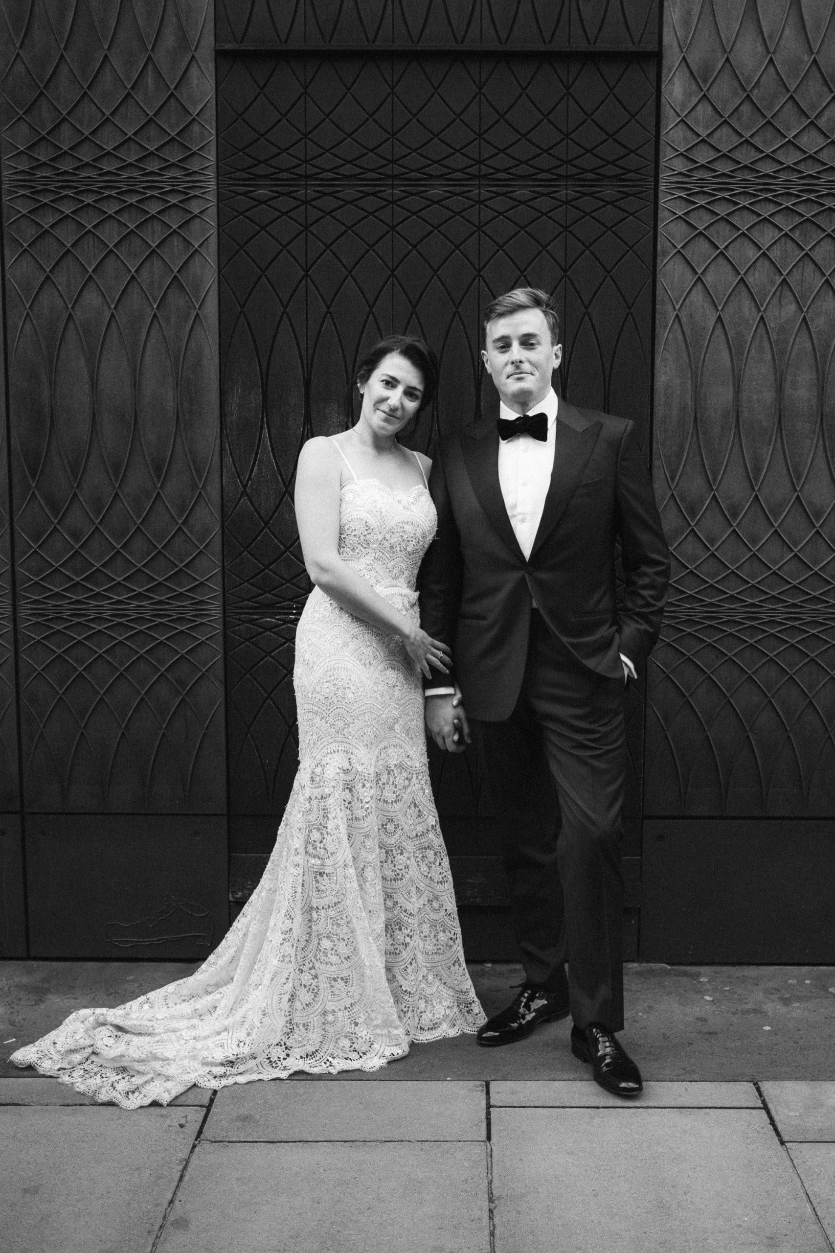 Bride and groom in front of a London doorway