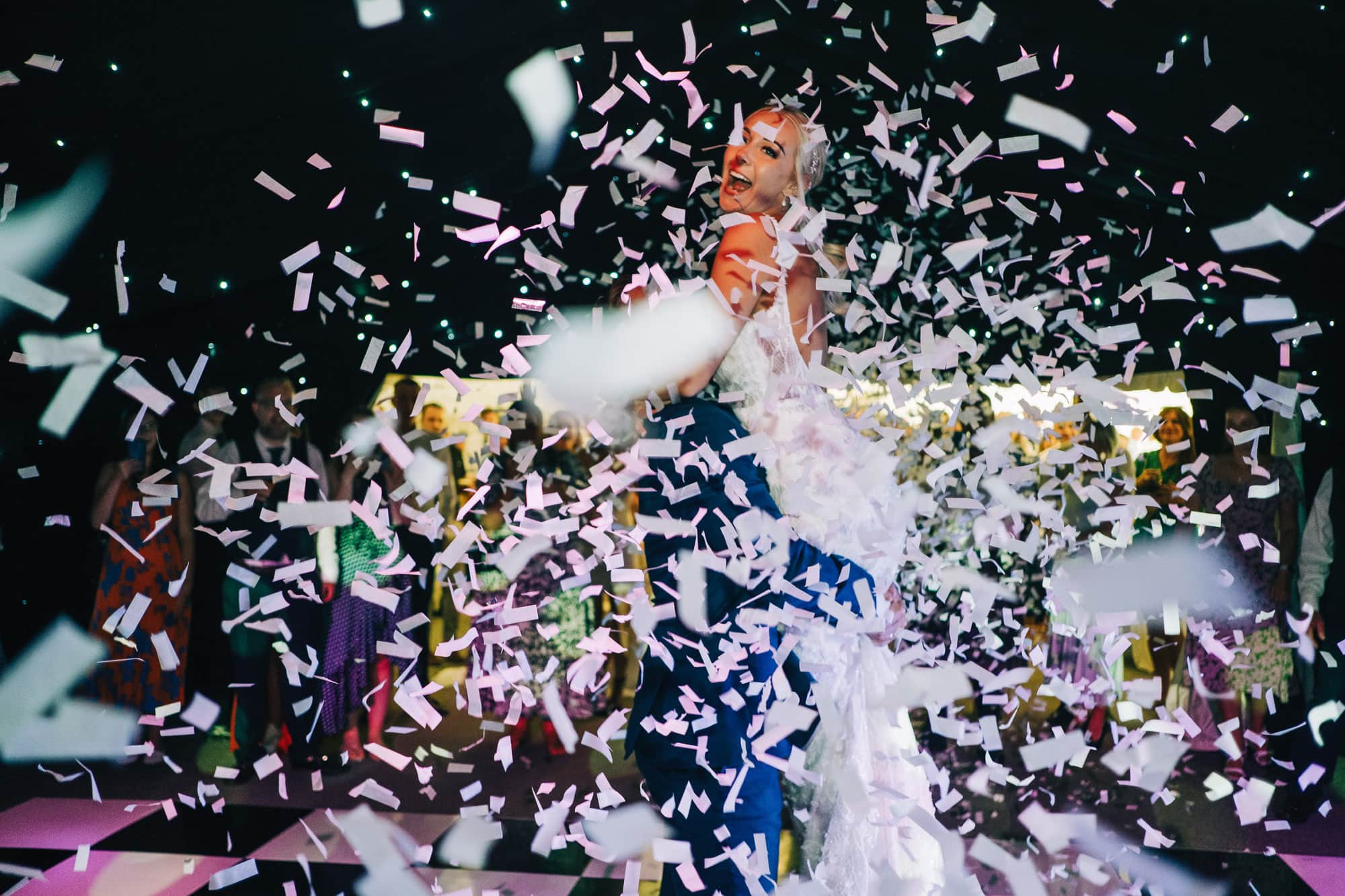 Bride celebrating under the confetti canon
