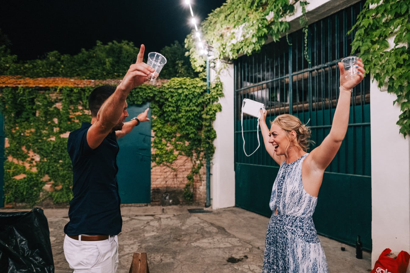 Guests downing shots at the wedding party