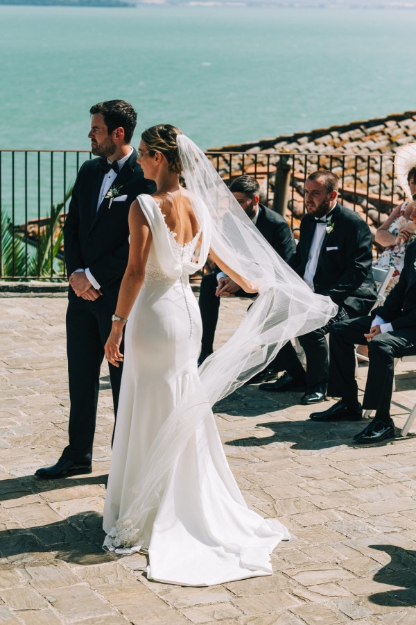Brides veil blowing in the wind at La Rocca di Passignano sul Trasimeno