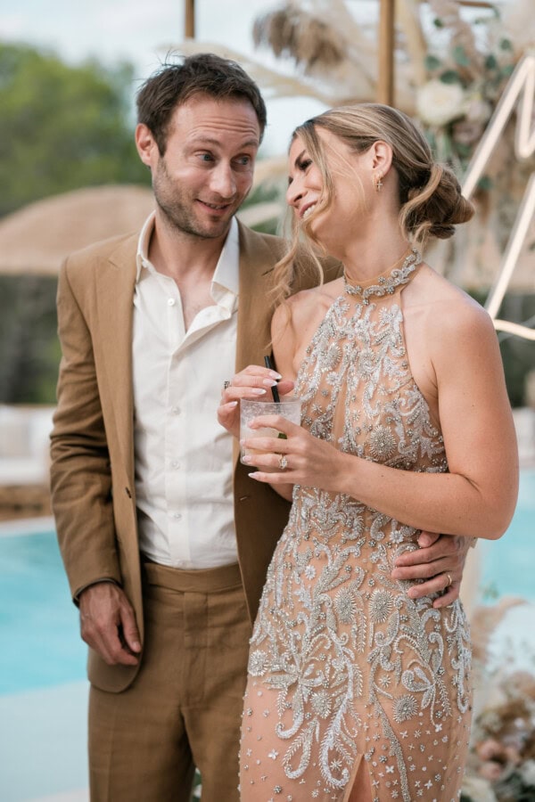Bride and groom smiling at each other