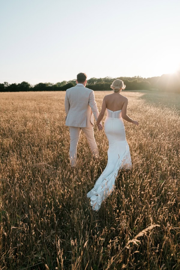 Bride & Groom in a golden field in the Cotswolds