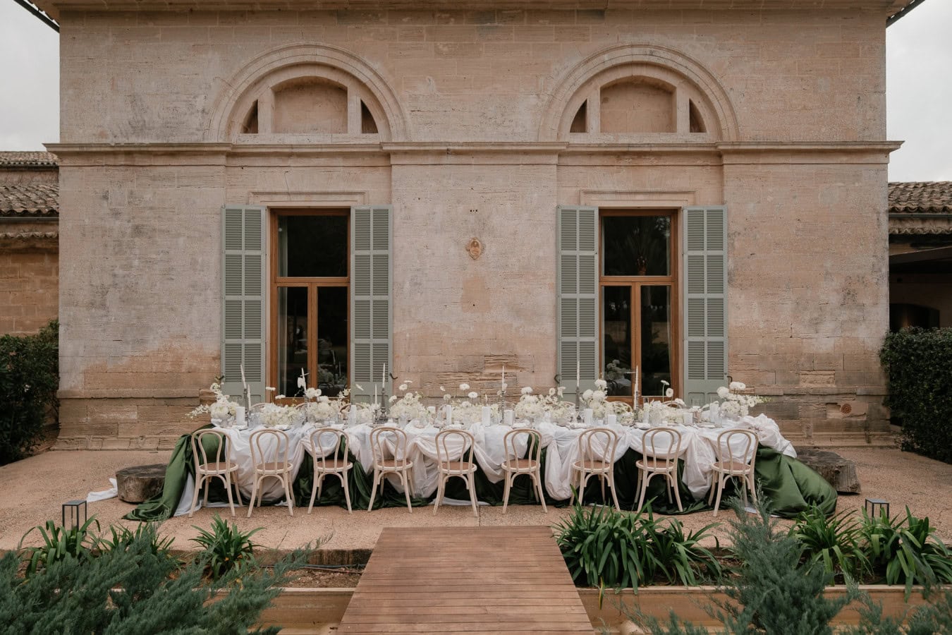 Long wedding table setup in front of Fontsanta Hotel
