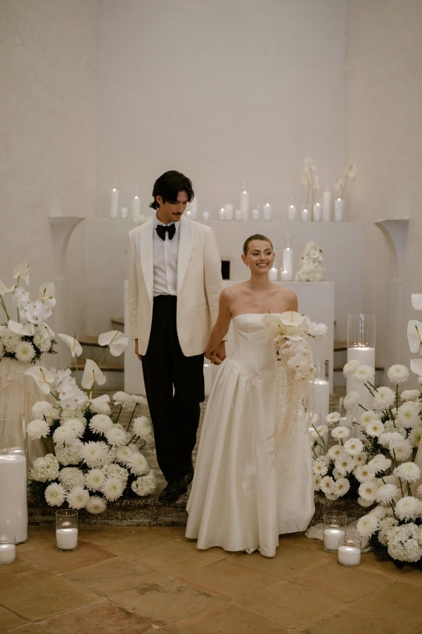 Bride and groom walking in the church at Fontsanta Hotel