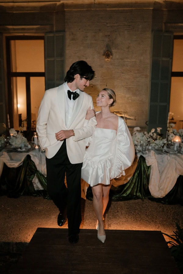 Bride and groom walking away from the dinner setup at Fontsanta Hotel