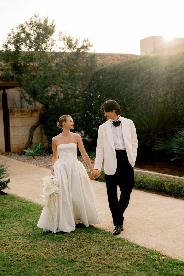 Bride & Groom walking with the golden sun shining
