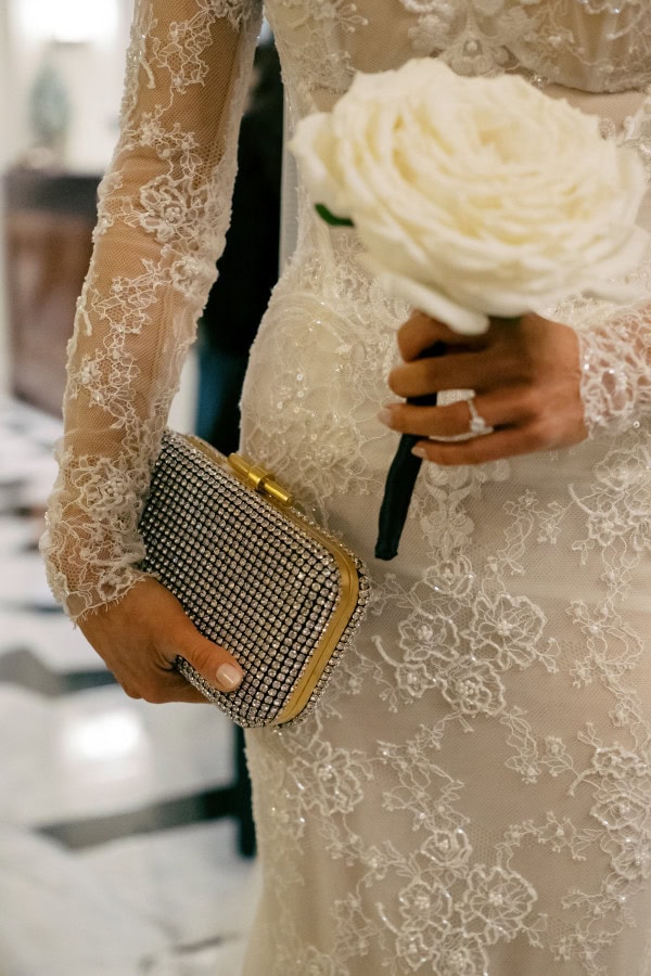 Close up of bride holding her clutch bag