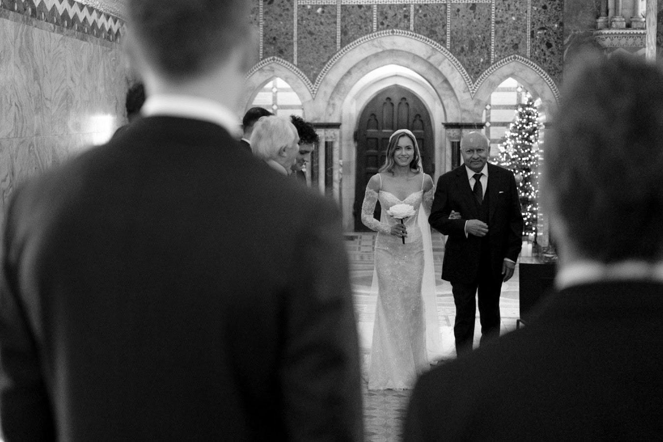 Bride and father walking down the aisle at Fitzrovia Chapel