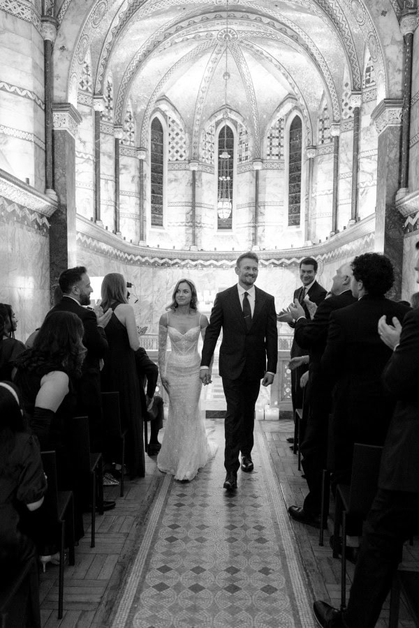 Bride and groom walking down the aisle at Fitzrovia Chapel