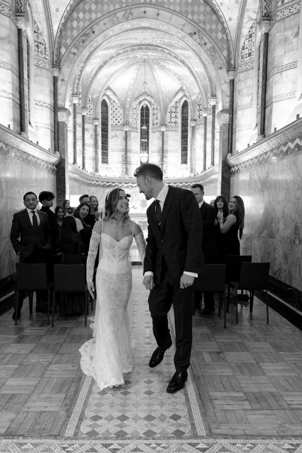 Bride and groom walking at Fitzrovia Chapel